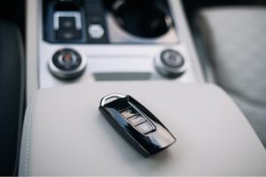 Car key lying on dashboard inside car