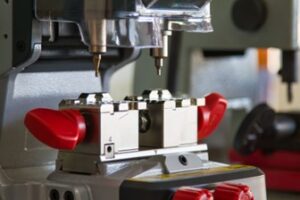 A machine manufacturing car parts in a factory